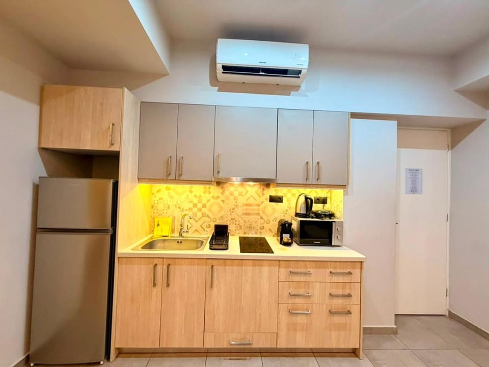Kitchen or kitchenette, microwave, stove, air conditioner
