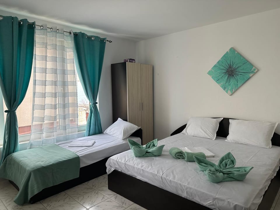 Bed, towels, wardrobe