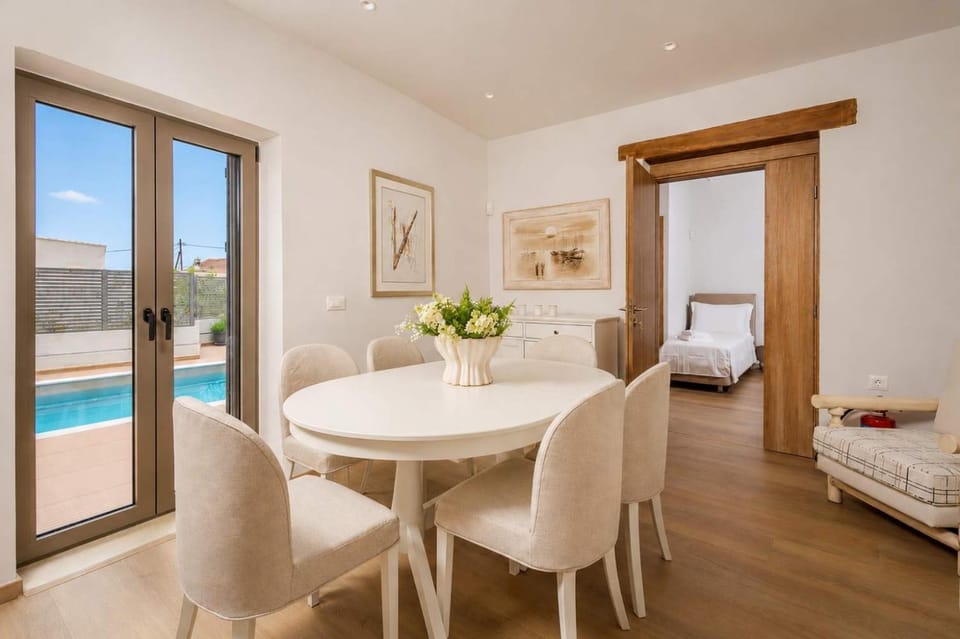 Living room, Seating area, Dining area, Pool view
