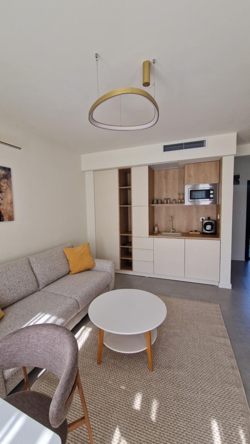 Kitchen or kitchenette, Living room, Seating area, Dining area