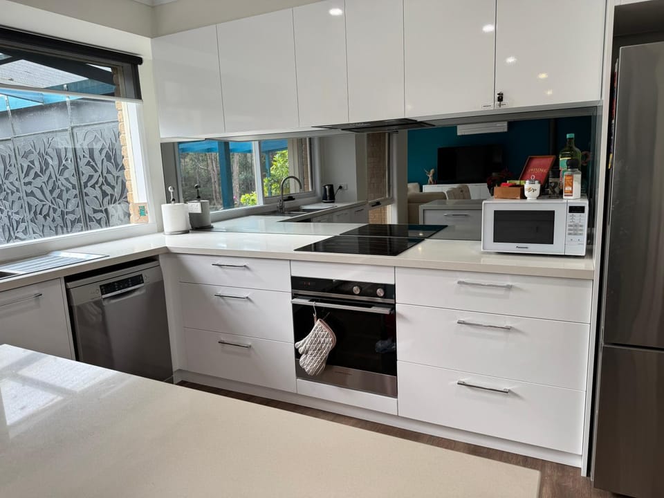 Kitchen or kitchenette, dishwasher, oven, stove, toaster