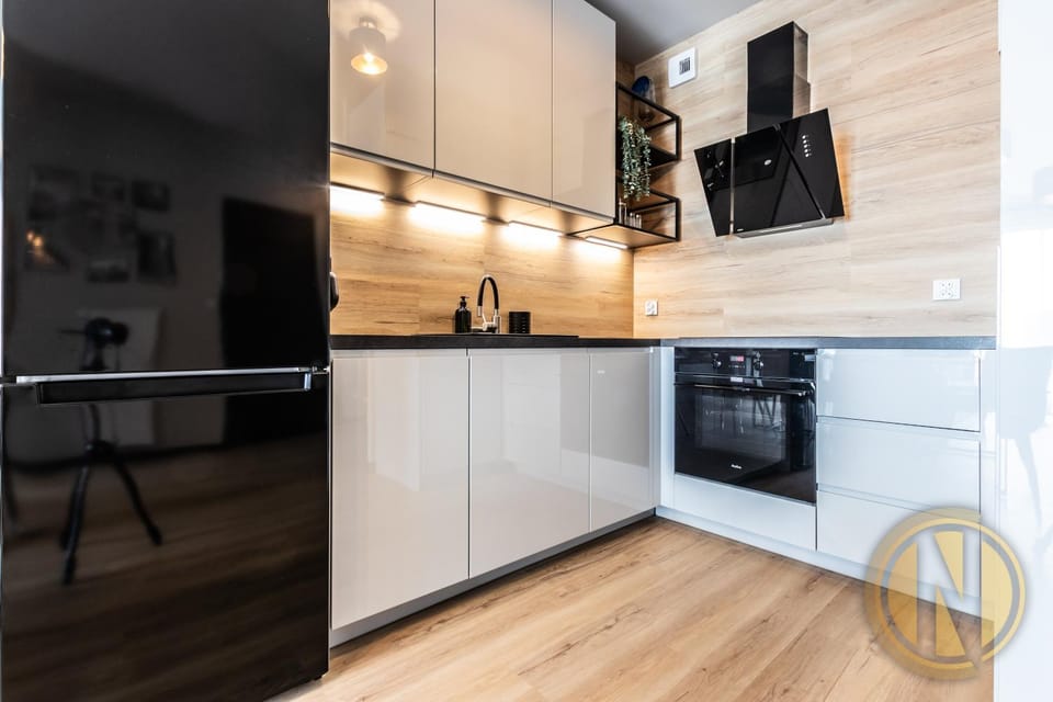 Kitchen or kitchenette, dishwasher, oven, stove