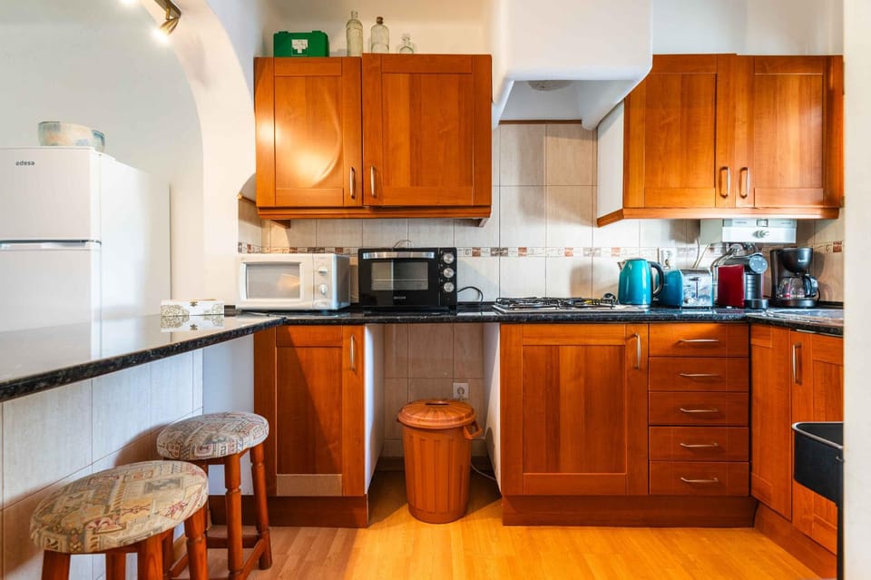 Kitchen or kitchenette, oven, stove, toaster