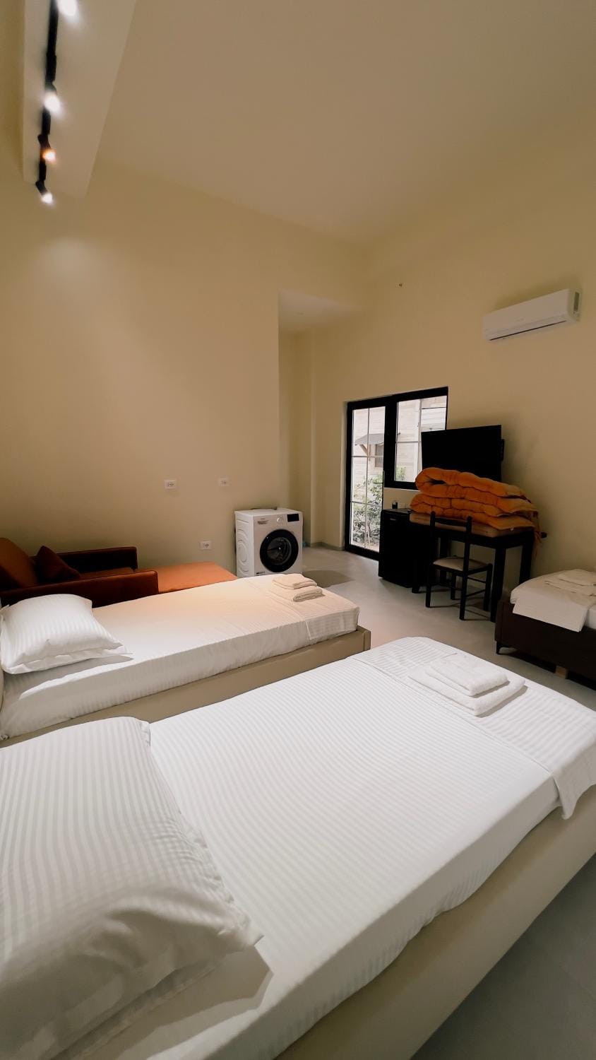 Bed, TV and multimedia, Photo of the whole room, Bedroom, hair dryier, wardrobe, washing machine, air conditioner