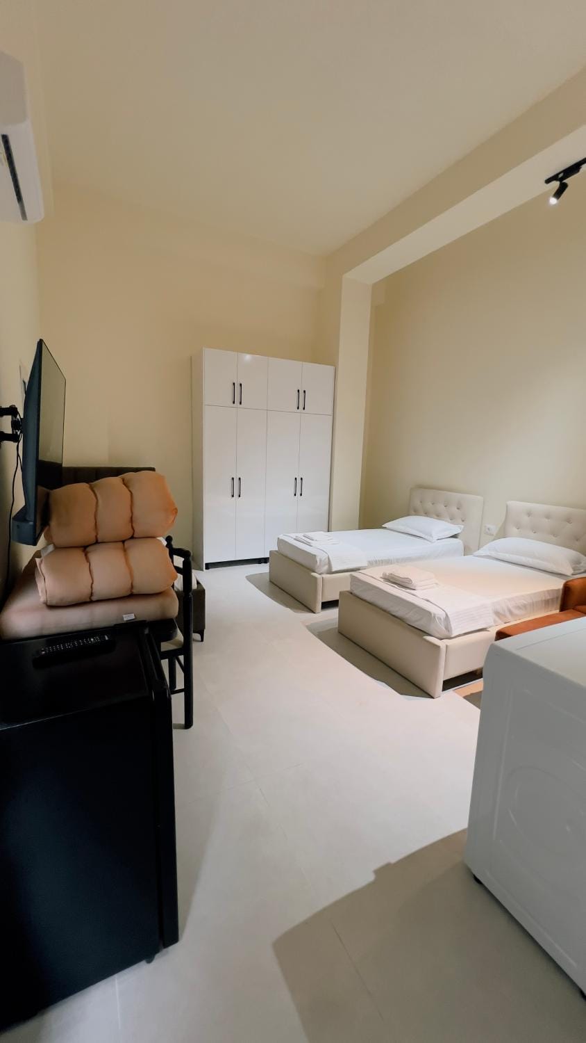 Bed, TV and multimedia, Photo of the whole room, Bedroom, hair dryier, towels, wardrobe, washing machine, air conditioner