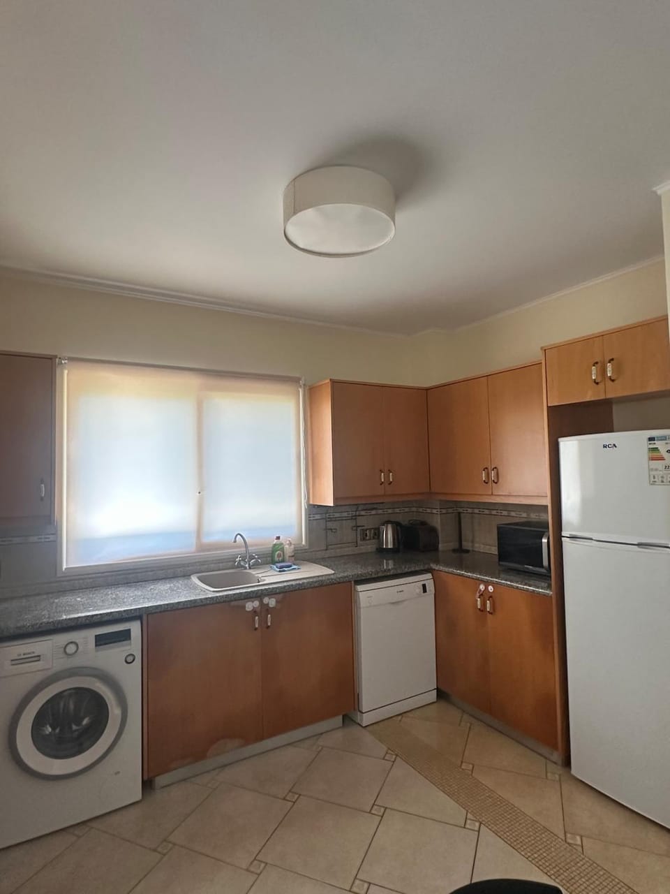 Kitchen or kitchenette, dishwasher, oven, stove, washing machine