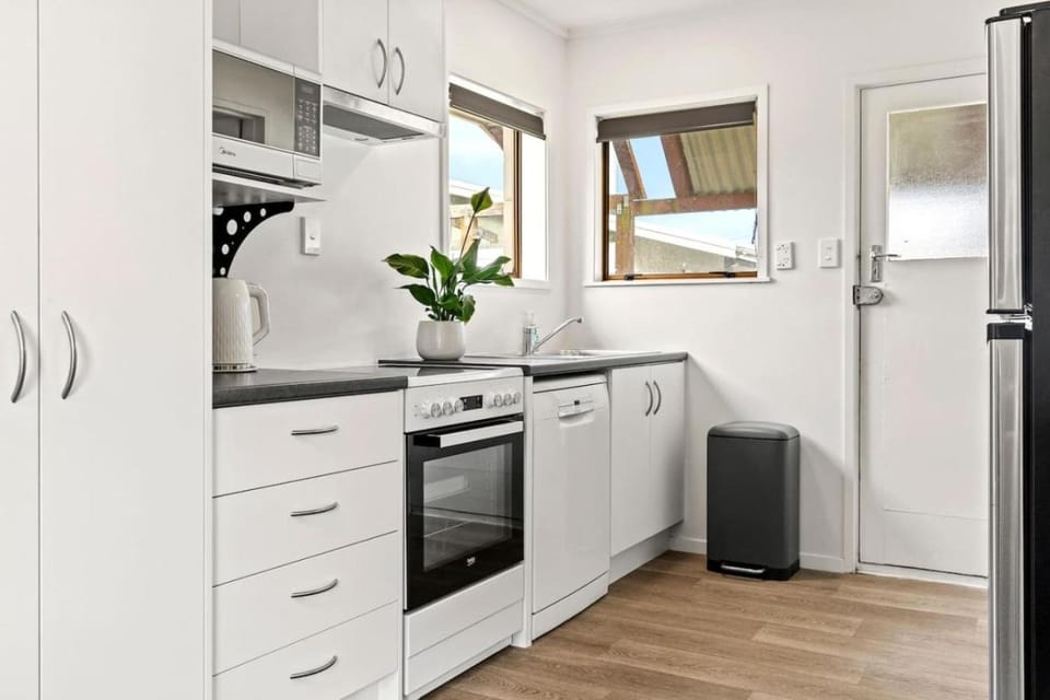 Kitchen or kitchenette, dishwasher, oven, stove