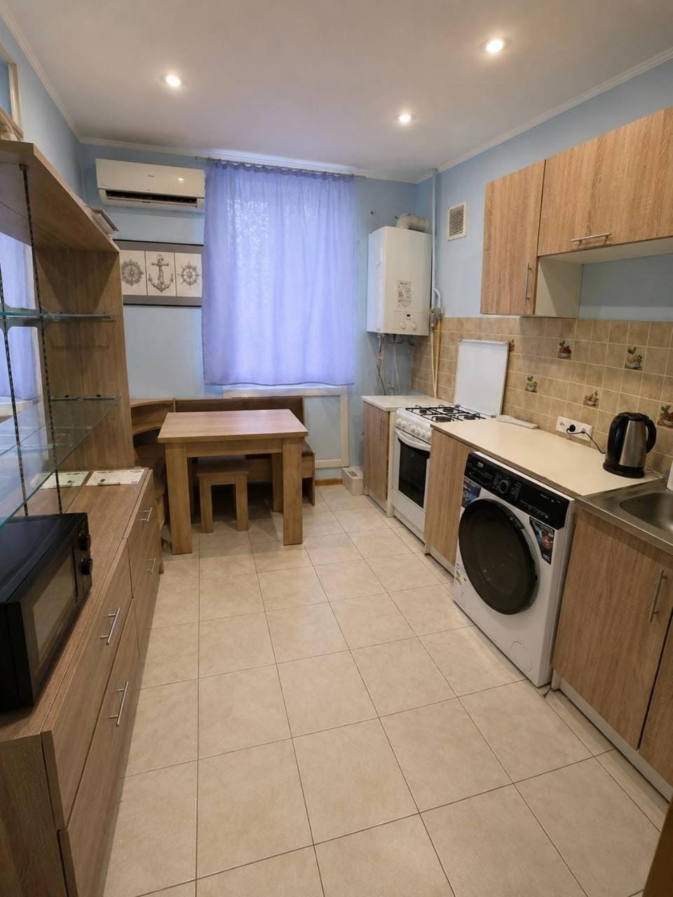 Kitchen or kitchenette, stove, washing machine