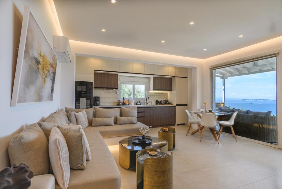 Kitchen or kitchenette, Living room, Seating area, Dining area, Sea view