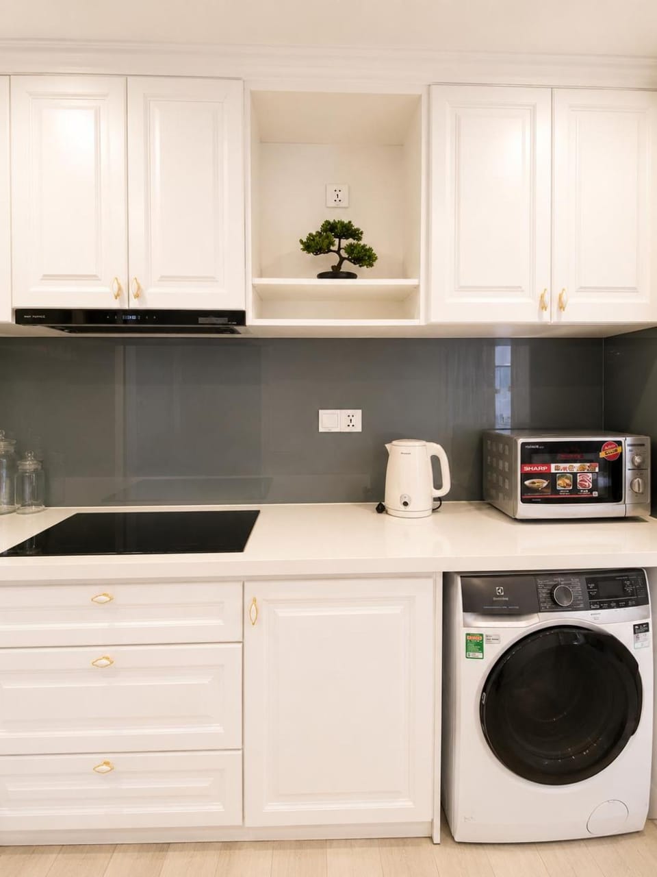 Kitchen or kitchenette, stove, washing machine