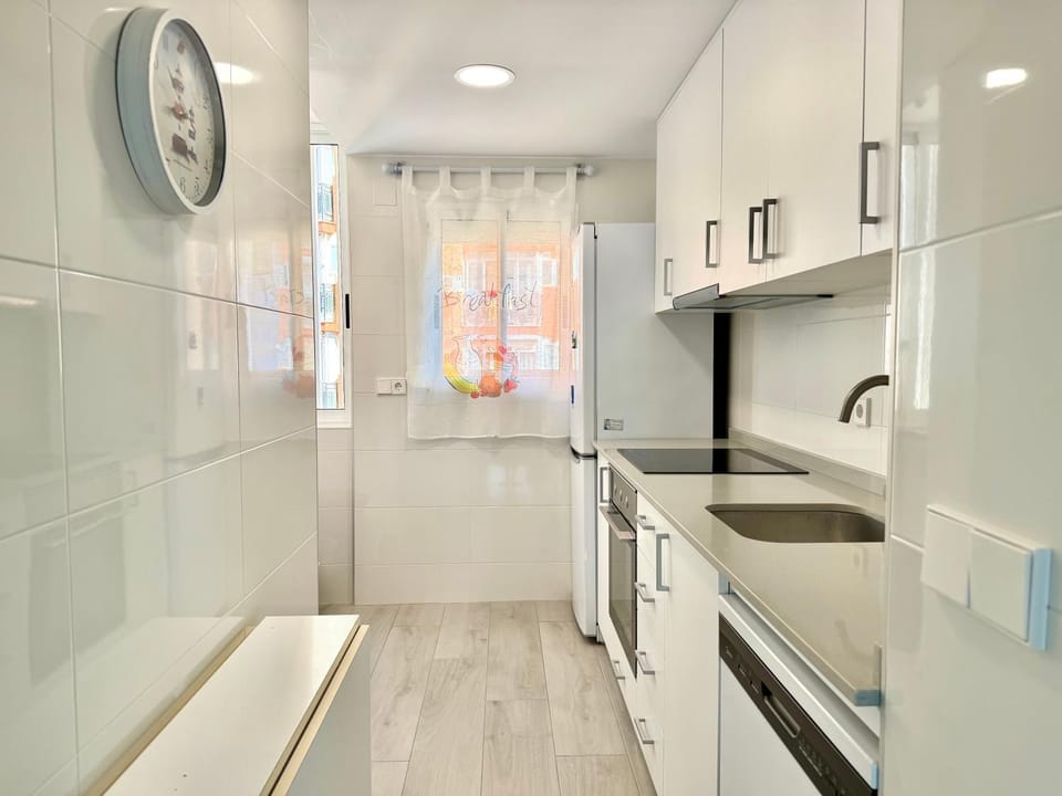 Kitchen or kitchenette, dishwasher, oven, stove