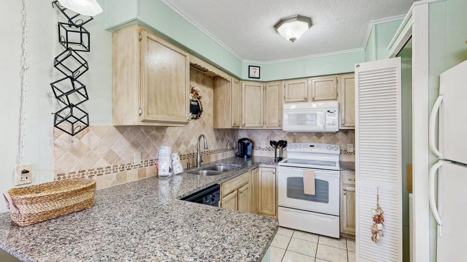 Inviting bayfront escape with outdoor seating pool and great location House in Ocean City
