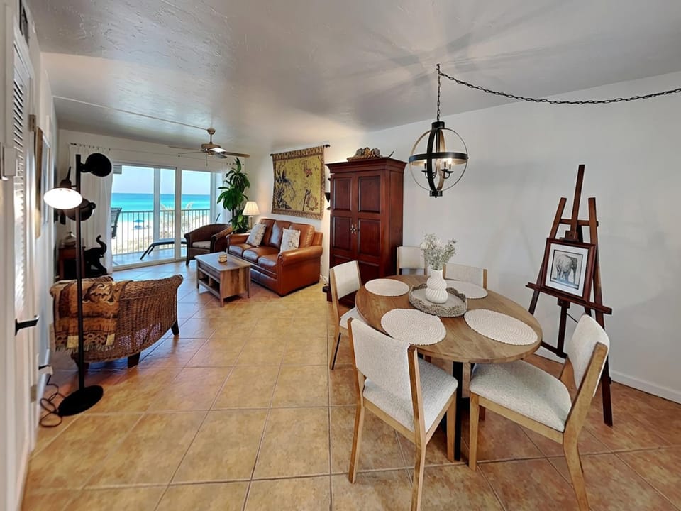 View (from property/room), Living room, Seating area, Dining area, Sea view, furniture, air conditioner