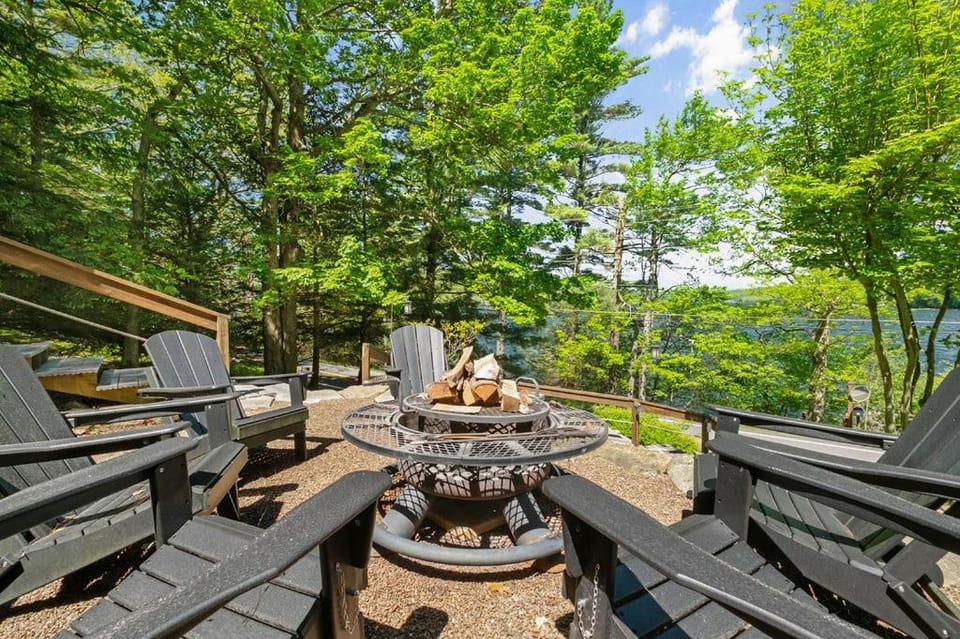 Spacious 7BR retreat with hot tub, fire pit, dock, and year-round views House in Deep Creek Lake