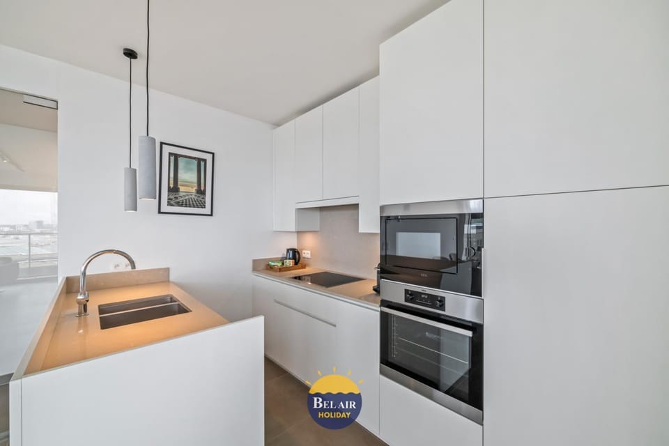 Kitchen or kitchenette, dishwasher, oven, stove