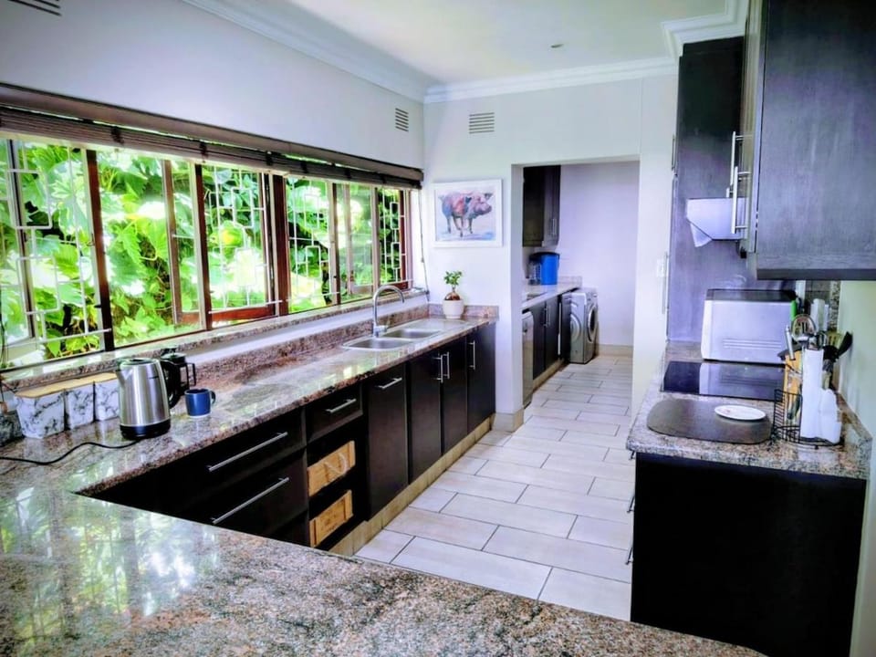 Kitchen or kitchenette, dishwasher, oven, stove