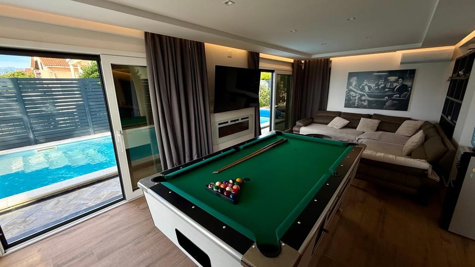Billiard, Billiard, Living room, Seating area, Pool view, Swimming pool