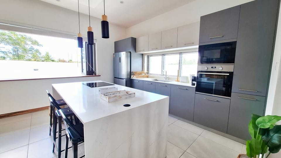 Kitchen or kitchenette, dishwasher, microwave, oven, stove, toaster