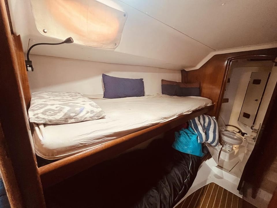 Sailboat Sleeping Experience Near Barcelona Docked boat in Castelldefels