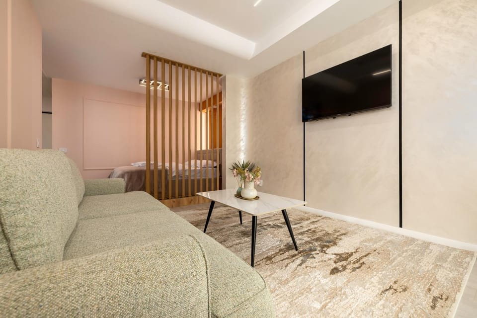 Bed, Living room, Seating area, Bedroom