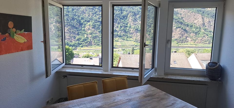 Natural landscape, View (from property/room), Living room, Seating area, Dining area, Mountain view, River view