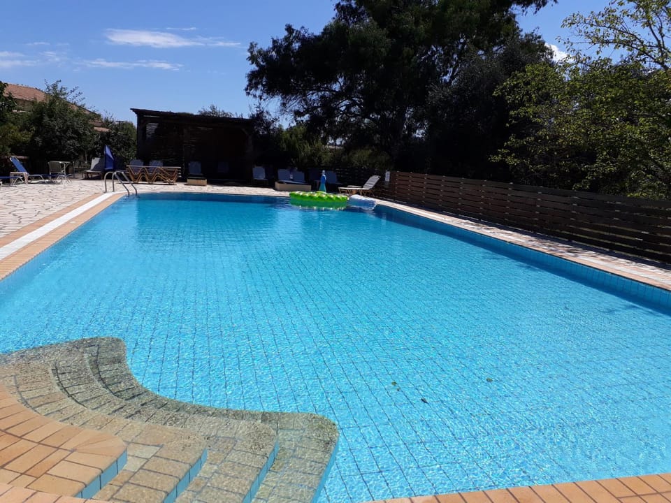 Property building, Living room, Swimming pool