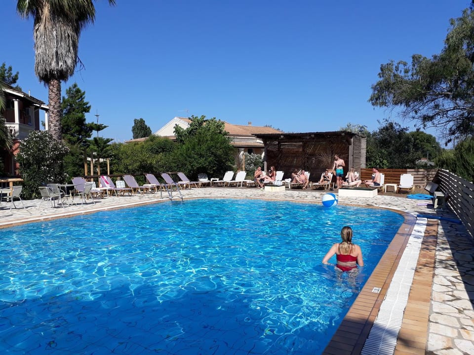 Property building, Living room, Swimming pool