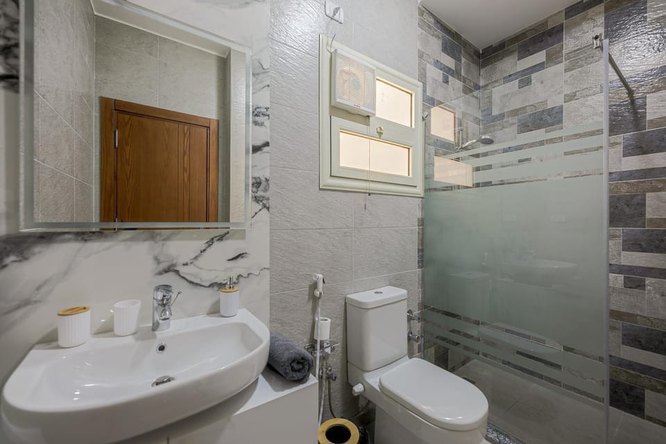 Shower, Bathroom, hair dryier, towels