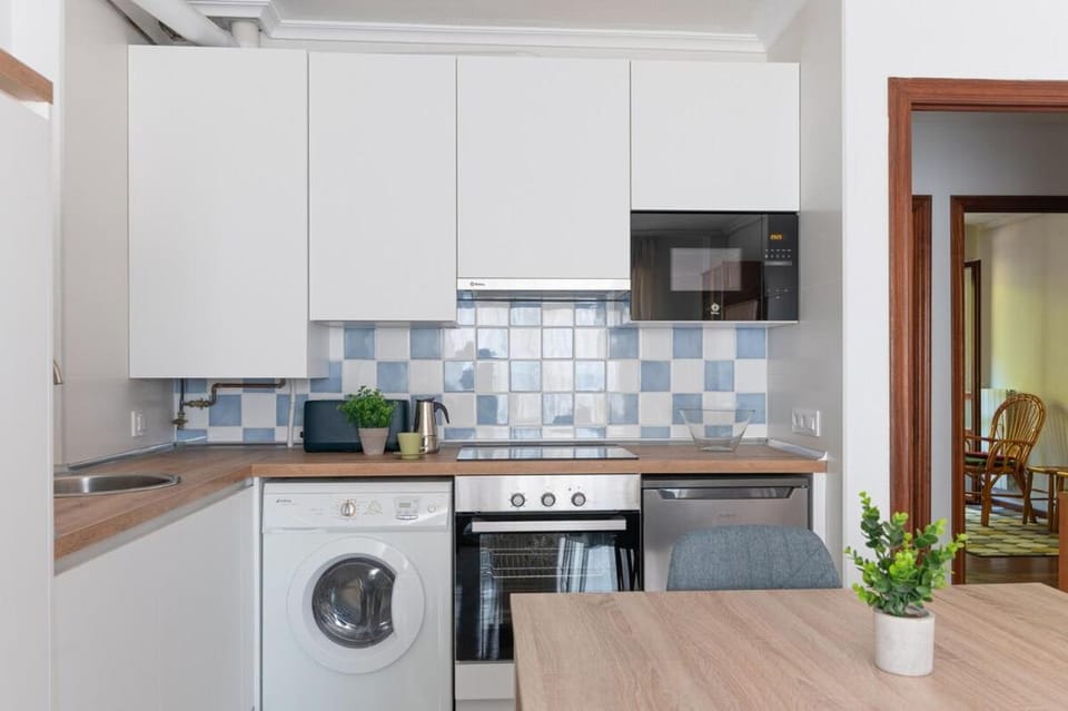 Kitchen or kitchenette, stove, washing machine