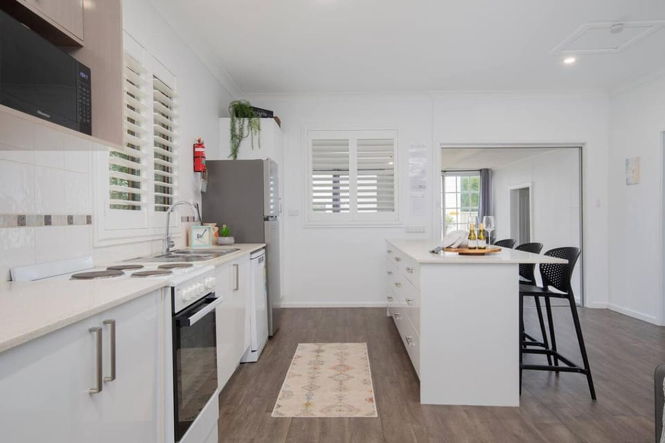Kitchen or kitchenette, dishwasher, oven, stove