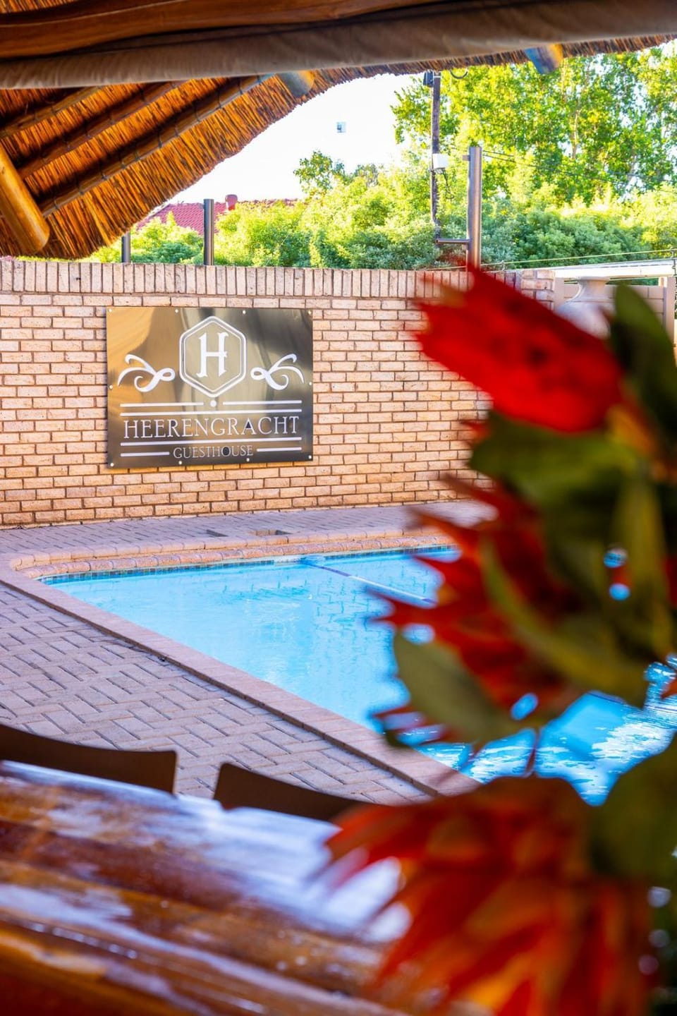 Property building, Restaurant/places to eat, Day, Property logo or sign, Pool view, Swimming pool
