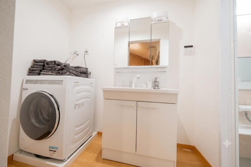 Bathroom, towels, washing machine, dryer
