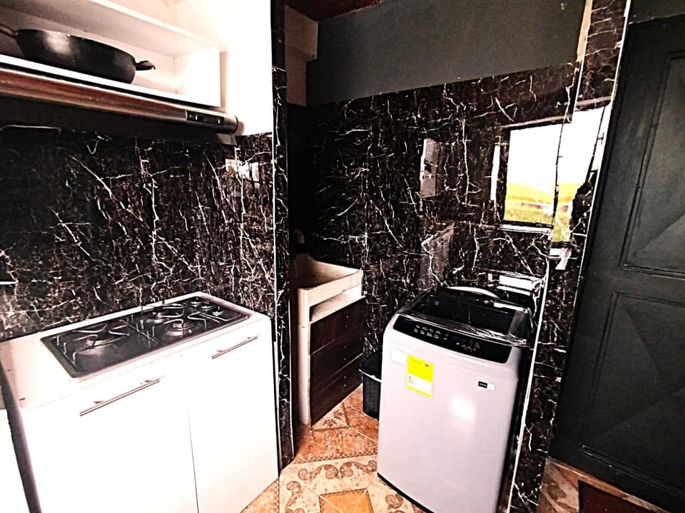 Kitchen or kitchenette, stove, washing machine