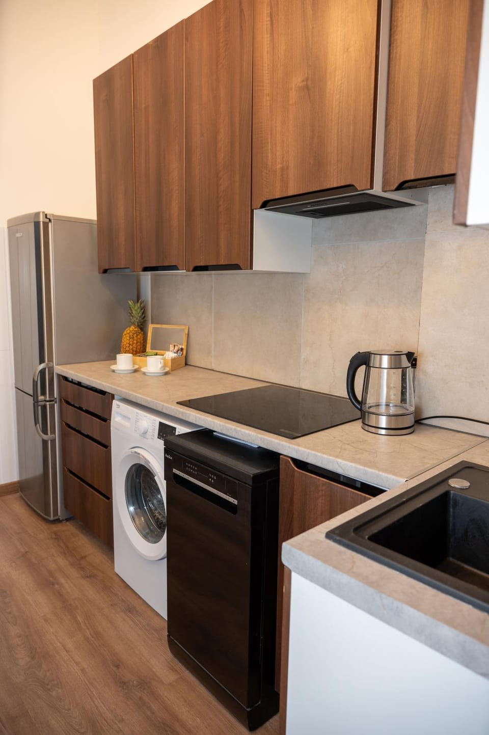 Kitchen or kitchenette, dishwasher, stove, laundry, washing machine, kitchen