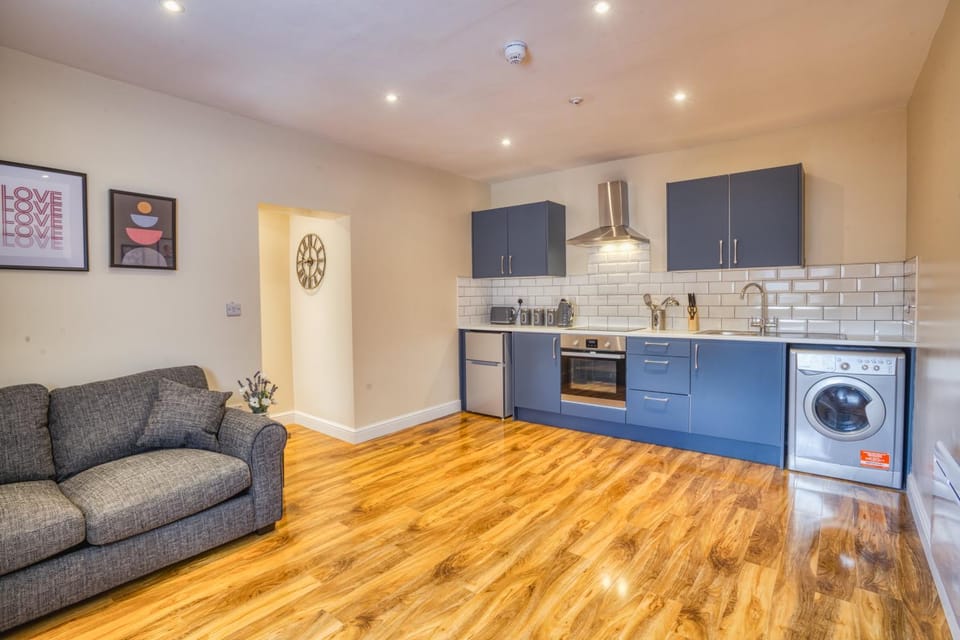 Kitchen or kitchenette, Living room, Photo of the whole room, Seating area, furniture, oven, washing machine