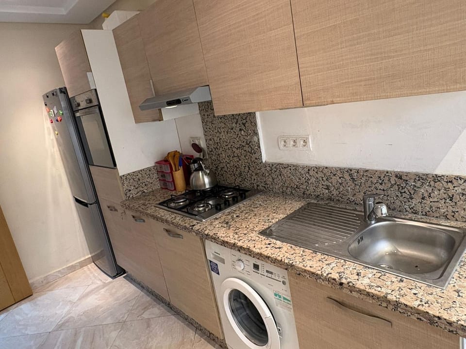 Kitchen or kitchenette, oven, stove, washing machine