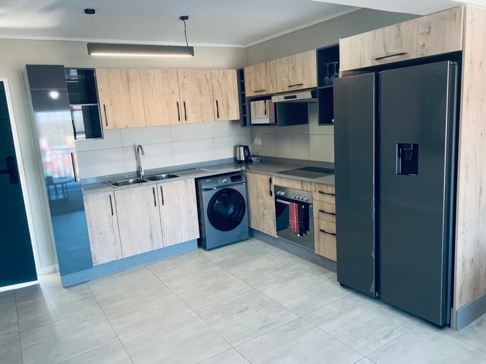Kitchen or kitchenette, oven, stove, washing machine, dryer