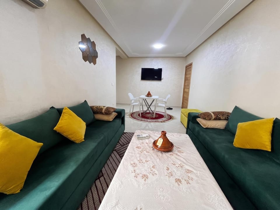 Bed, TV and multimedia, Living room, Seating area, air conditioner