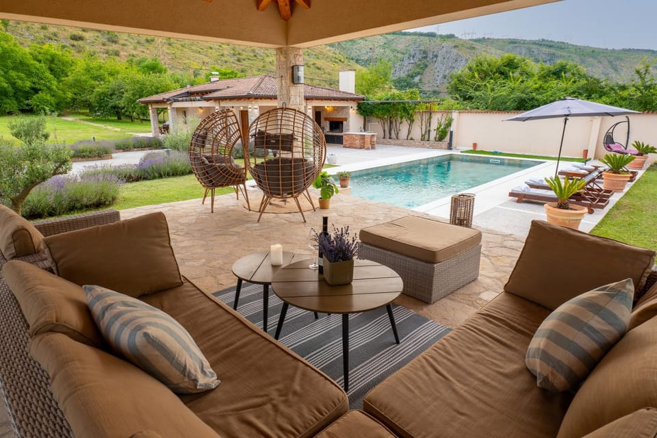 Property building, Patio, Seating area, Swimming pool