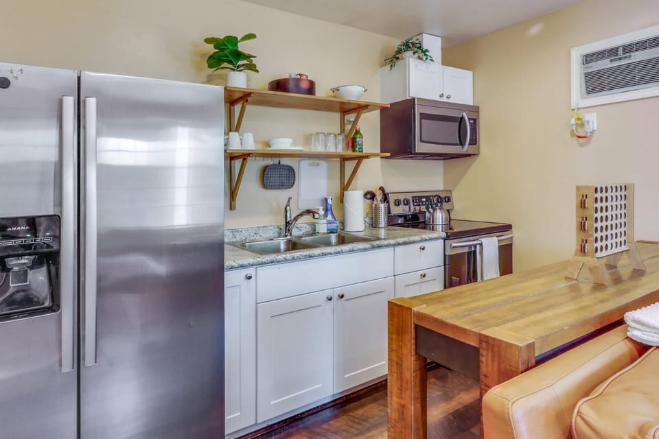Kitchen or kitchenette, furniture, microwave, air conditioner