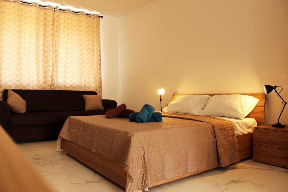 Bed, Living room, Seating area, Bedroom