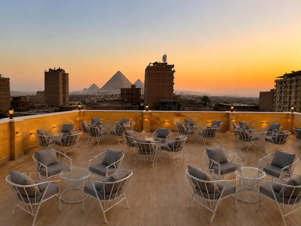 Property building, Patio, Day, Natural landscape, View (from property/room), Balcony/Terrace, Balcony/Terrace, Living room, Seating area, City view, Sunrise, Sunset