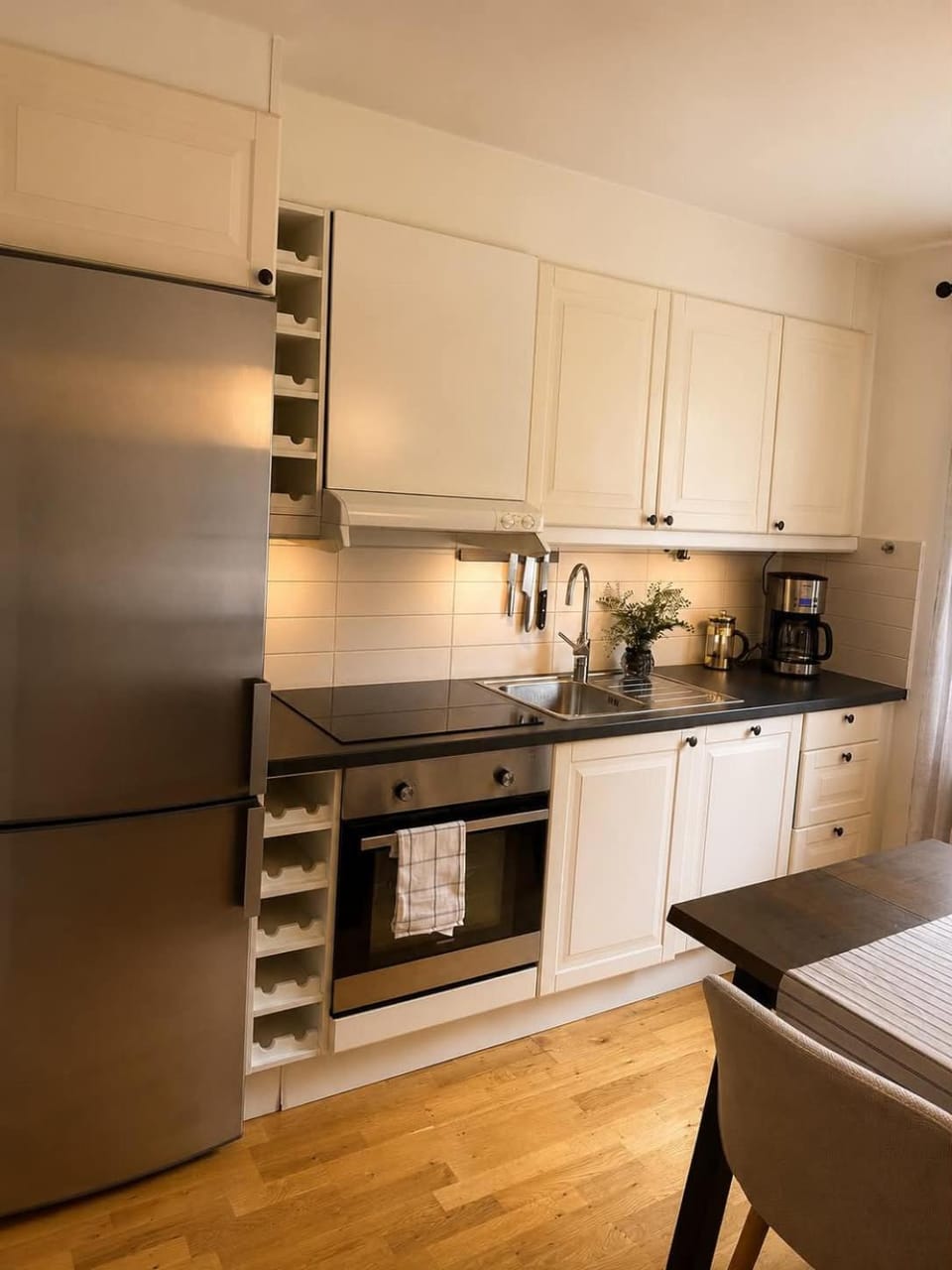 Kitchen or kitchenette, dishwasher, oven, stove