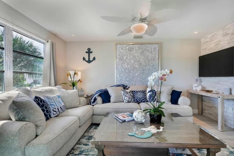 Beachside Canal Retreat with Private Balcony, Island Views & Coastal Charm - The Shore - Roelens House in Estero Island