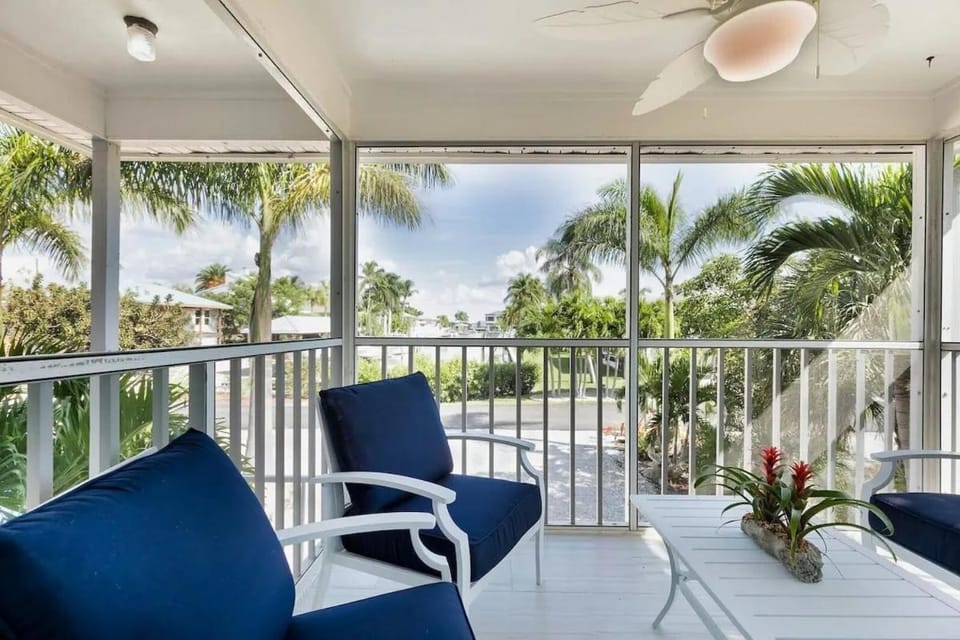 Beachside Canal Retreat with Private Balcony, Island Views & Coastal Charm - The Shore - Roelens House in Estero Island