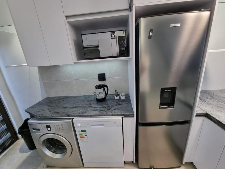 Kitchen or kitchenette, dishwasher, microwave, washing machine