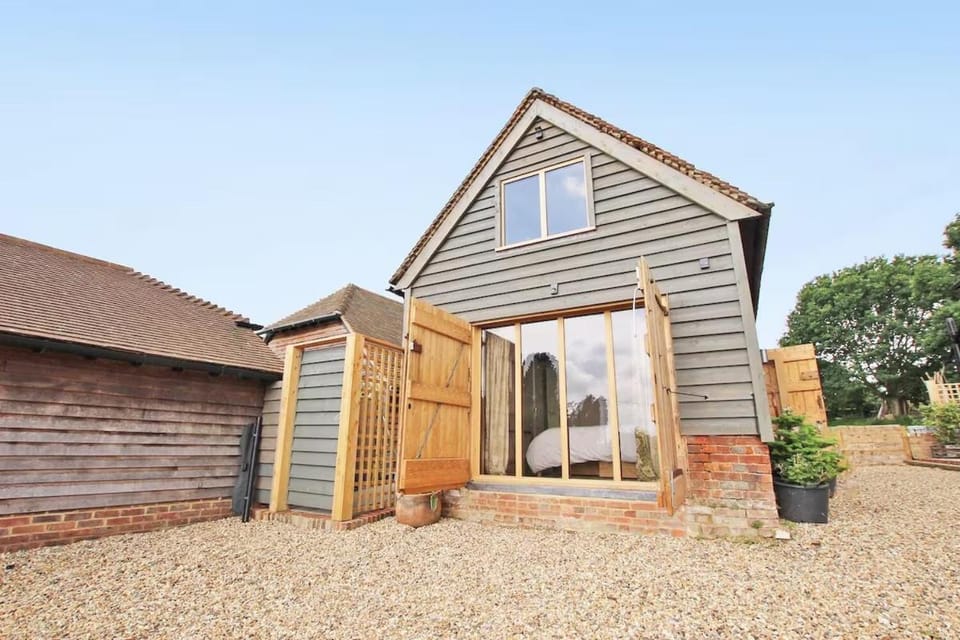 Contemporary converted barn off the village green House in Rother District