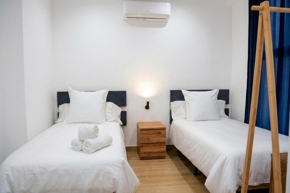 Bed, Photo of the whole room, Bedroom, towels, air conditioner