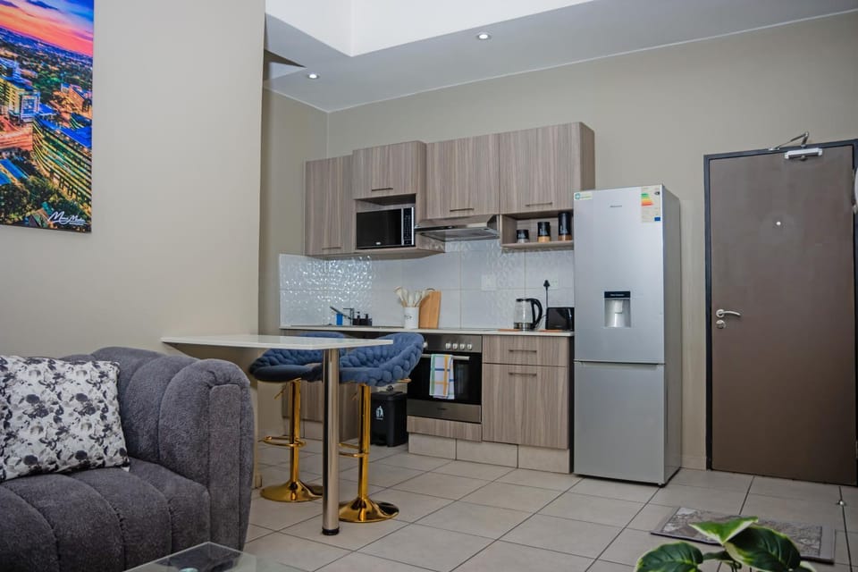 Kitchen or kitchenette, Living room, Seating area, Dining area, oven, stove, toaster