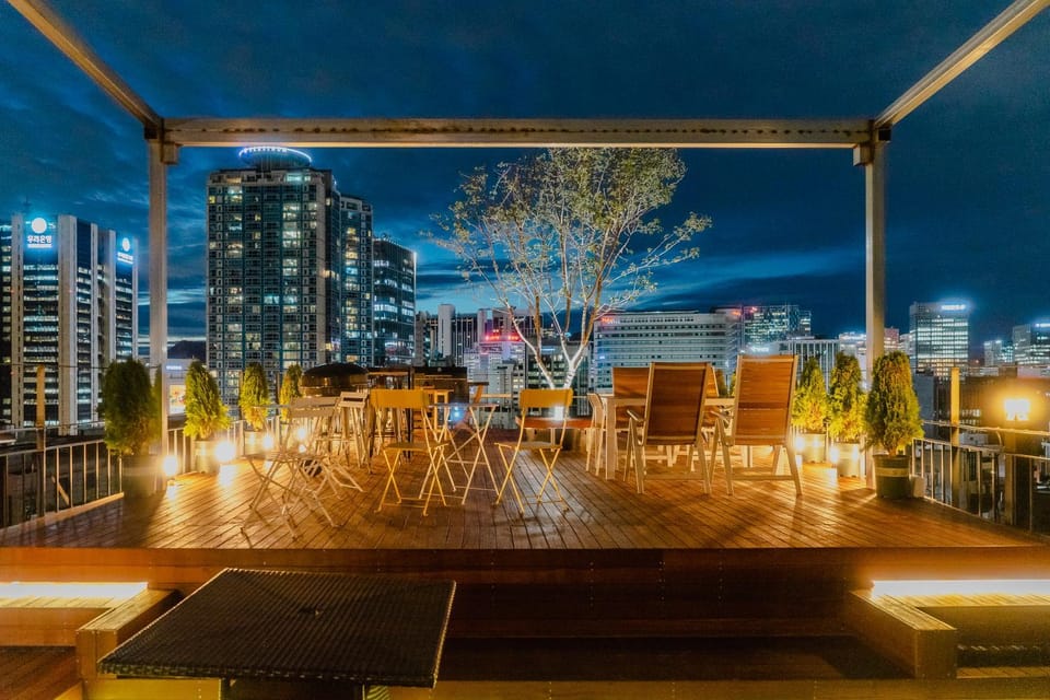 Property building, Patio, Night, View (from property/room), Balcony/Terrace, Living room, Seating area, City view